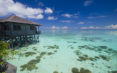 Tropical island resort on crystal clear water.
