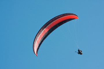 Paragliding pilot in the air