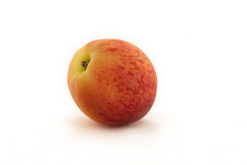 Nectarine set against a white background