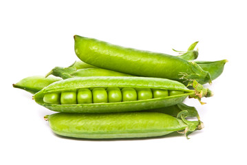 Pods of fresh green peas on a white background