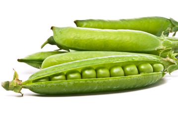 Pods of fresh green peas on a white background
