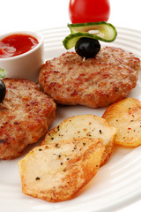 Fried steaks with chips and vegetable salad isolated on white