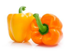 fresh yellow orange peppers isolated on white