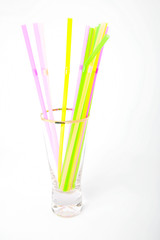 Plastic drinking straws in glass