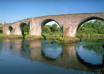 Fototapeta na wymiar Old stone bridge