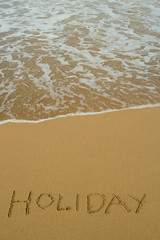 Holiday written in the Sand