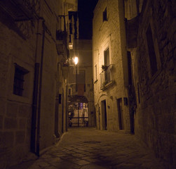 Alley by night. Giovinazzo.