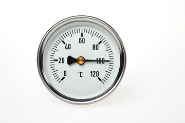 A water boiling point temperature on a circular thermometer.