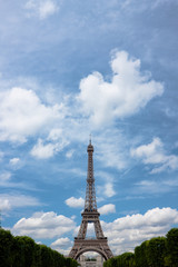 Fototapeta na wymiar Eiffel tower with clouds. Portrait. Copy space.
