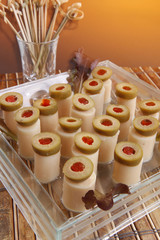 Hearts of palm canapes topped with stuffed olives