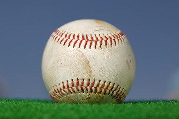 Baseball on Green Grass