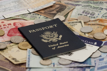 Passport with Foreign Money and Plane Tickets