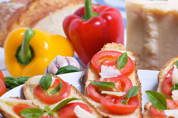 Bruschette with tomato, basil and cheese