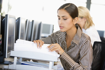 Stock Trader Going Through Paperwork