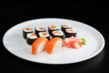 Set of sushi and rolls with a salmon