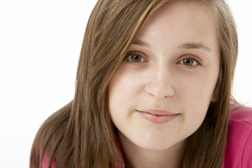 Naklejka premium Studio Portrait Of Smiling Teenage Girl
