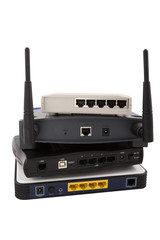 Pile of network devices on white background