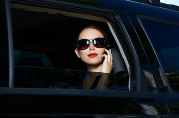 Portrait of beautiful business woman inside the limo car - obrazy, fototapety, plakaty