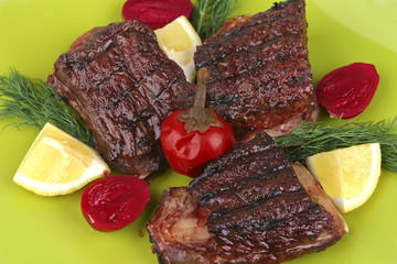 roast rib's on green dish