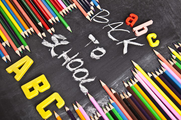 Fototapeta na wymiar Colour pencils, alphabet and back to school