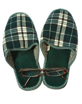 Home  slippers and spectacles isolated on white