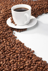 Cup with coffee, costing on coffee grain