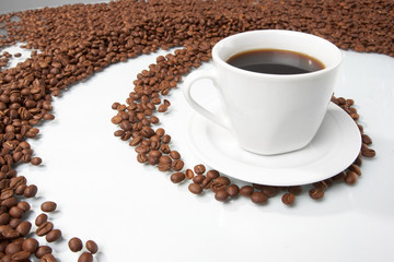 Cup with coffee, costing on coffee grain