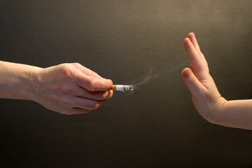 cigarette for child - hands
