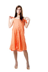 brunette girl in the orange dress isolated on a white background
