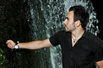 man under the waterfall