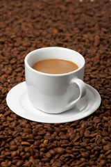 Cup with coffee, costing on coffee grain