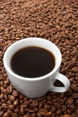 Cup with coffee, costing on coffee grain