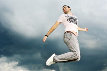 Fototapeta na wymiar man jumping to the sky