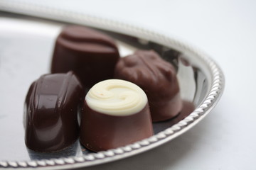 Belgium chocolate pralines on silver plate
