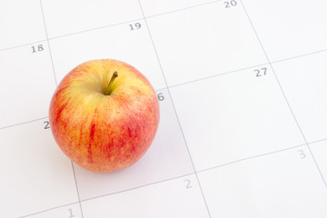 Red apple on calendar