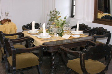 Old chairs and table setup in the castle.
