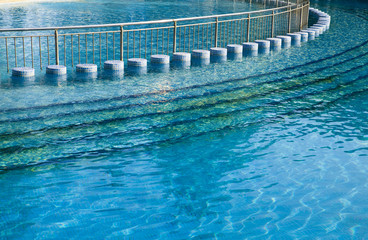 Empty swimming pool bright solar day