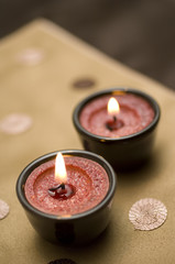 Candles on a brown silk background, homes and interiors