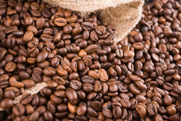 coffee beans poured out of a sack down