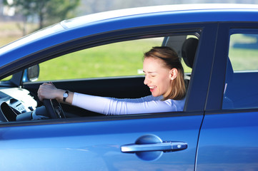 Woman is extremely happy with her new car