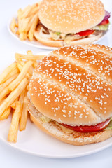 two cheeseburgers with fries