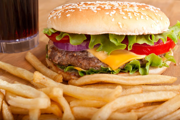 cheeseburger with fries and a drink