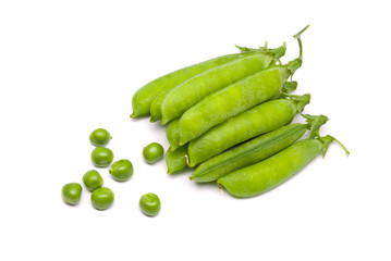 Pods of fresh green peas on a white background