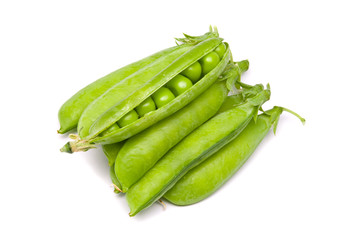 Pods of fresh green peas on a white background