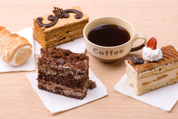 Biscuit cakes with cup of coffee