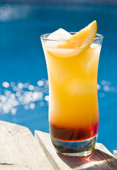 Tequilla Sunrise Cocktail by the Pool