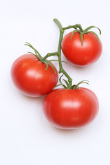 three tomatoes on white background