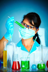 scientist in laboratory with test tubes