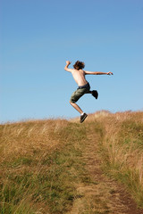 Young man jumping for joy