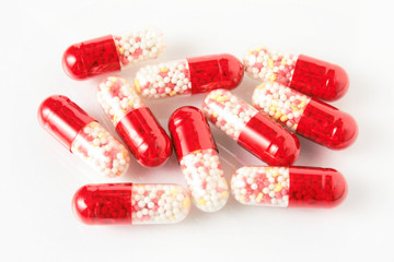 Doctor's stuff. Pills spilled on a glass surface